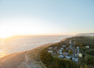 Wall Mural - A beautiful beach with a small town in the background