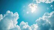 © sirisakboakaew - Clear blue sky with a few fluffy white clouds, bright and vibrant, perfect summer day atmosphere, refreshing and minimalistic, suitable for versatile stock usage,