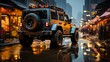 © danadesa - A gray SUV drives down a city street after a snowfall.  The street is wet from the melting snow. The SUV has a spare tire on the back, a roof rack, and mud flaps.