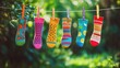 © ChiffonCake - Colorful socks hanging on a line in nature