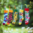 © Boonart - Fun socks hanging on a clothesline, bright colors and patterns, National Sock Day spirit