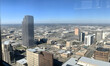 © Eddy Drmwn - Aerial view of a city skyline with skyscrapers and buildings.