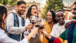 © Davide Angelini - Happy friends toast with red wine at a vineyard - Group of young people enjoying happy hour at rooftop winery bar - Gathering and beverage life style concept