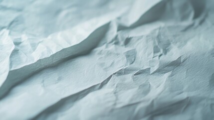 Poster - Close-up of crumpled paper with unique texture and light play, ideal for creative designs. White paper with hints of blue and gray adds roughness and depth to projects