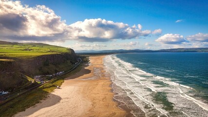 Flight along the west coast of Northern Ireland at Downhill Beach on a sunny day