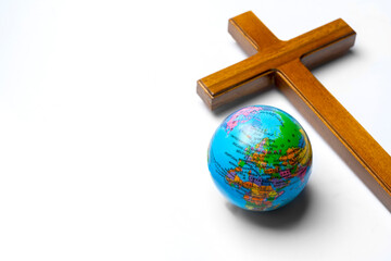 Religion christianity cross and globe on white background. Symbol of faith and worship in God