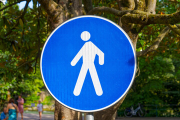 Looking up blue and white colored road sign pedestrian walkway on a sunny summer day at Italian City of Meran. Photo taken July 15th, 2024, Merano Meran, Italy.