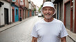 © QuoDesign - Senior man wearing white t-shirt and white bucket hat standing in a city alley