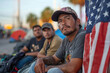 © Vovmar - A group of migrants at the border between Mexico and the United States. A Latino man sits near a US flag.