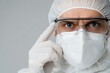 © Sanchat - Scientist in protective gear, focused expression, white background