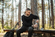 © Dusan - Young caucasian man drinking water taking break from hiking or trekking