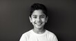 © Arceli - hispanic latino teen boy black background wearing plain white tshirt smiling happy portrait