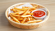 © abdlkerim - French fries in a bamboo plate with ketchup in a white plate, on a wooden table, close up capture from left to right, fast food concept