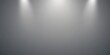 © Andrey - A gray background with three lights shining on it