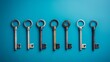 © Maksym - A collection of vintage keys in various styles arranged neatly on a blue background