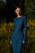 © Michael Shifrin - A model in a tight blue dress poses in nature
