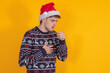 © carballo - young man with christmas clothes and santa claus hat isolated