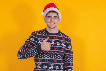 isolated boy with christmas clothes and santa claus hat