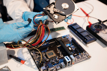 Close up of Technician measuring voltage electronic circuit board, Service after sale fix electric equipment.