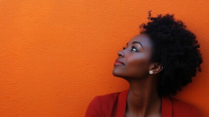 Canvas Print - Woman Looking Up Against Orange Background