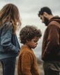 © Sasint - Parents turning their backs on each other while their child is crying in the middle, representing the pain and conflict within the family,