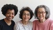 © Rufino - Three women with glasses and one with a black afro are smiling for the camera