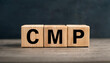 © hardvicore - Wood cubes with abbreviation text CMP on wooden table. Certified Meeting Professional.