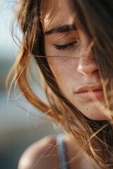 Sorrowful woman experiencing stress or depression in a serene coastal setting, grappling with loneliness, mental health issues, and feelings of confusion or crisis