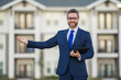© Volodymyr - Real estate agent business man in suit hold holder clipboards outside. Hispanic Businessman. Business Man broker or real estate agent. Business man in suit outdoor. Real estate business man.