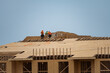 © Volodymyr - Wooden roof beam from framework. House roof at construction site. Roofer working on roof structure of building on construction site. Wooden roof beams.