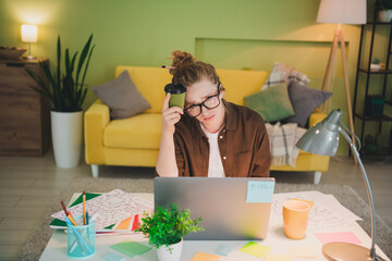 Photo of bored upset lady wear shirt eyeglasses feeling tired working modern device indoors workplace workshop