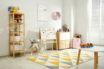 Wall Mural - Beautiful child's room interior with toys and stylish furniture