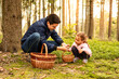 © kieferpix - Father child picking mushrooms in the forest with basket in autumn forest mushroom picking season, family outdoor activities, leisure and self sustainability concept