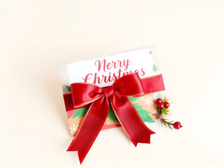 A beautifully wrapped Christmas card featuring a red bow and festive greenery on a soft background capturing holiday cheer