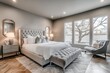 © AI04 - A beautiful bedroom in a new luxury home featuring a large window and an area rug