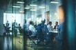 © melhak - A large group of people sitting at a table in a meeting room - People