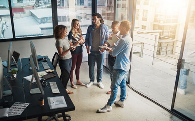 Fototapete - Meeting, collaboration and planning with business people in office for teamwork, support or diversity. Lens flare, creative and entrepreneur with group of employee in startup for project management