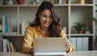 © mzory - Happy Freelancer: Young Hispanic Woman Working Online