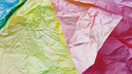 Poster - A close-up view reveals a texture of crumpled paper displaying bright colors like blue, yellow, green, and pink, creating an abstract, playful aesthetic perfect for crafts.