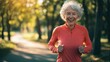 © Ben Trobat - Smiling elderly woman jogging in the park on a sunny day