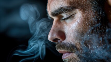 Wall Mural - A serene young man with closed eyes, surrounded by a mystical swirl of smoke, exuding calm and introspection.