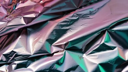Poster - A vibrant and crinkled metallic foil showcases a blend of colorful reflections, creating an intriguing textured surface perfect for creative projects or backgrounds.