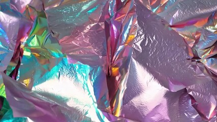 Leinwandbilder - A vibrant display of colorful reflective foil exhibits a stunning iridescent effect, perfect for enhancing creative artwork and presentations. The shimmering surface attracts the eye.