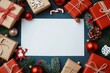 © SEUNGJIN - Above view festive composition of gift boxes and christmas ornaments with blank white piece of paper to write holiday greetings or with list. Mock up, copy space for your text.