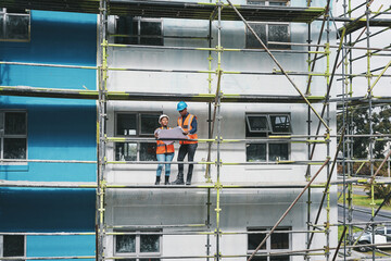 Aufkleber - Construction site, business people and blueprints for progress, scaffolding and planning with safety. Employees, man and woman with documents, teamwork and engineering with architecture and planning