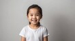 © Arceli - east asian kid girl white background wearing plain white tshirt smiling happy portrait