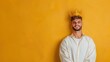 © hisilly - Confident Bearded Man in Crown and Mantle Smiling for Camera on Yellow Background