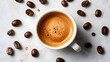 © FiDIO - Hot espresso coffee with beans on white table, top view
