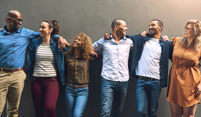 Poster - We will always have each other. Shot of a group cheerful friends holding each other while posing for a photo outside of a building.