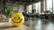 © Htet Wai Phyo - Positivity in the workplace demonstrated by a yellow smiling ball in the office interior, promoting a positive work environment and inspiring corporate culture.